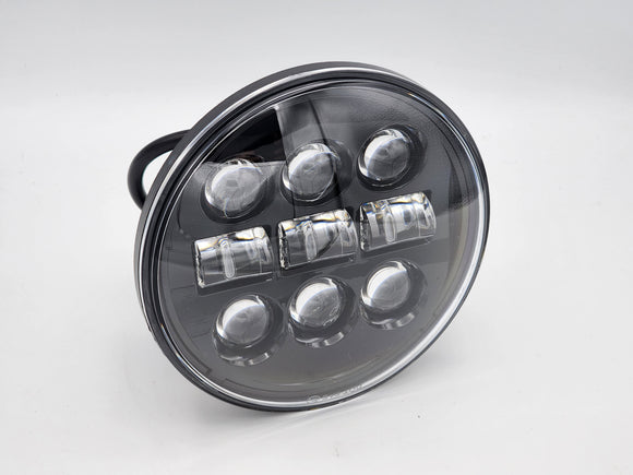 5.75 in LED Motorcycle Headlight with 9 bulbs and a black background.